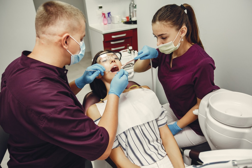 Patient during tooth extraction procedure at dentist